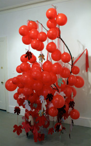 Carole Loeffler, aggregate threads (of connection), 2014, 91”x 54”x49”, branch, balloons, ribbon, string, felt 