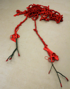 Carole Loeffler, palpable threads, 2014, 99’ long x 2-3” x branches 21” & 24” length, fabric, wood, ribbon, glitter glue